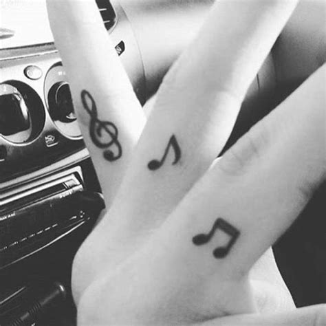 music note finger tattoo